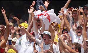 England's barmy army celebrate the wicket of Langer