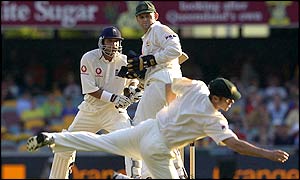 England's Mark Butcher finds a gap between Australia's fielders on day two