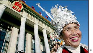 A delegate from China's southern Guizhou province stands outside Beijing's Great Hall of the People