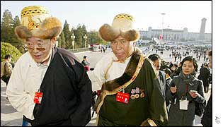 Two Tibetan delegates walk up the steps of Beijing's Great Hall of the People as they arrive for the opening session of the 16th Chinese Communist Party Congress 8 Nov 2002. 