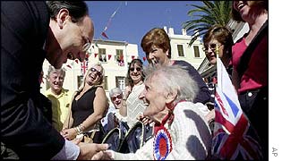 Mr Caruana congratulated by elderly demonstrator