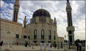 Iraqis walk outside Baghdads Umm al-Maarek mosque on Friday