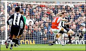 Arsenal's Dennis Bergkamp sees his shot hit the woodwork as the Gunners start well against Newcastle at Highbury