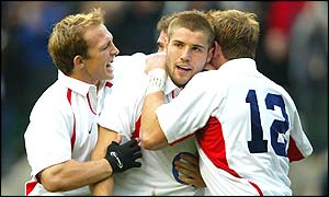 Matt Dawson, Ben Cohen and Mike Tindall celebrate another England try