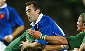 Thomas Castaignede powers through the South African tackles in his comeback game