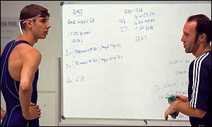Darren Mew from Great Britain discusses his traing program with one of the team coaches during a training session at the Melbourne Sports and Aquatic Centre