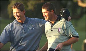 Goosen and Padraig Harrington share at joke on the first day at Valderrama