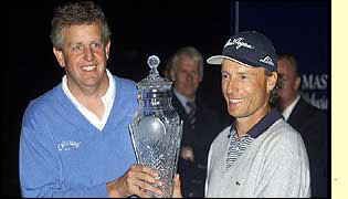 The fading light forced Colin Montgomerie and Bernhard Langer to share the Volvo Masters