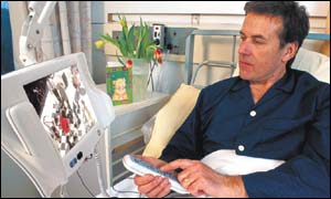 Patient with handset (courtesy of Patientline)