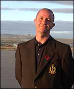 Ian at the Falkland Islands Defence Force HQ, with Stanley harbour and Mt Low behind