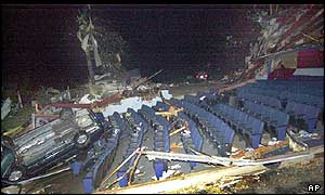 Car lies upside down in auditorium of wrecked cinema, Van Wert, Ohio