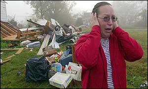 Distraught woman cries in front of her destroyed home in Carbon Hill, Alabama