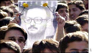 Iranian students hold up a picture of condemned lecturer Hashem Aghajari