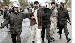 Police leading away two students