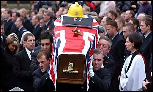 Mourners at the funeral of Rob Miller