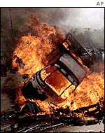 A truck on fire during riots in Gujarat's commercial capital Ahmedabad