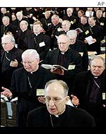 US bishops pray during their annual meeting