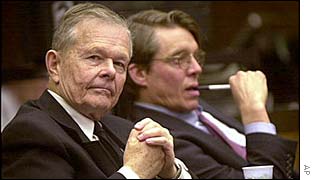 Defrocked priest John Geoghan (l) with his lawyer at his trial