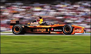 Heinz-Harald Frentzen, who is claiming money from the team, drives his Arrows past the crowd at the German GP