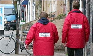 Wardens patrolling street