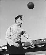 Portmsouth's Jimmy Dickinson heads the ball