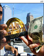 A tourist buys a souvenir near ground zero, where the twin towers once stood.