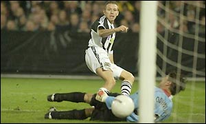 Craig Bellamy scores for Newcastle shortly before half time