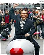 Protester wears George W Bush mask