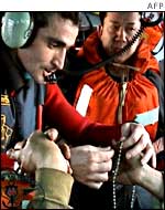 Crew members from the Prestige tanker on board a rescue helicopter