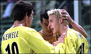 Alan Smith celebrates his second goal with his team-mates