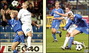 Ipswich full-back Chris Makin wins an aerial challenge while team-mate Alan Armstrong leads a rare attack