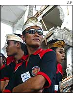Balinese security guards guard the site of the ceremony