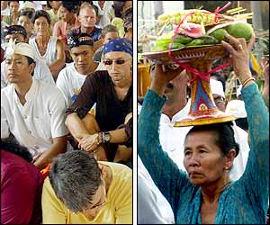 Foreign tourists sit with local residents during the ceremony (AFP photo); Balinese women carry oblation (AP photo)