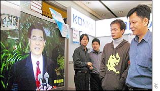 Chinese watch Hu Jintao on TV