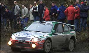 Kenneth Eriksson's Hyundai passes close to fans on the 2001 Rally GB