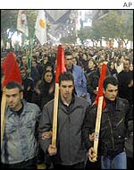 Demonstrators at a march organised by the Greek Communist Party in Thessaloniki against UN proposals for a reunification deal over Cyprus 