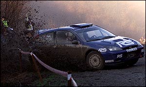 Markko Martin sends a wave of mud flying