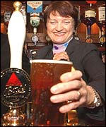 Tessa Jowell serving at the Red Lion bar