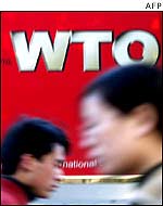 People passing WTO poster in Beijing