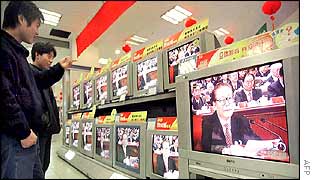 Jiang Zemin appears on television screens in a shop