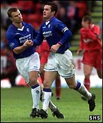 Ferguson is congratulated by Arthur Numan