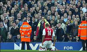 Thierry Henry celebrates in front of Spurs fans