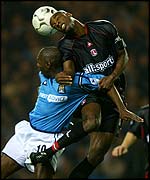 Charlton's Richard Rufus outjumps Shaun Goater