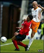 Steven Murray feels the force of Philippe Brinquin