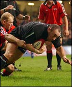 Wales hooker Robin McBryde scores a try