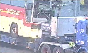 The WR Spring & Son coach being towed away by police