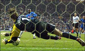 Fulham's Edwin van der Sar saves Stern John's tame penalty