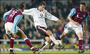Ruud van Nistelrooy is kept at bay by the West Ham defence - but one mistake is all he needs
