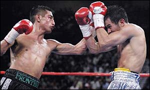 Eric Morales hits Marco Antonio Barrera with a left hook during their second fight 