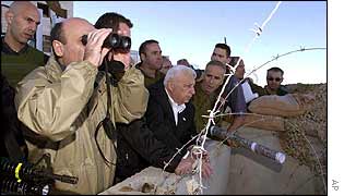 Ariel Sharon (centre) with military officials overlooking Hebron